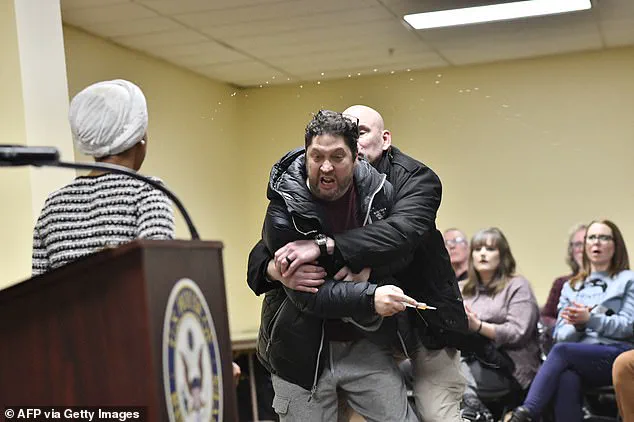 Trump supporter arrested and charged with assault after spraying Congresswoman Ilhan Omar with liquid at Minneapolis town hall