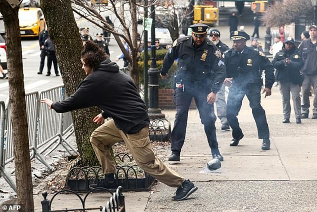 NYPD Officer's Heroic Barrier-Leap Goes Viral with Meme-Worthy 'Some Heroes Wear Blue' Caption
